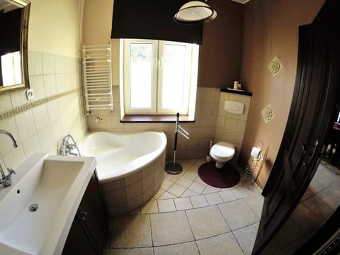 Apartment | Bathroom | Separate tub and shower, hair dryer, towels, shampoo