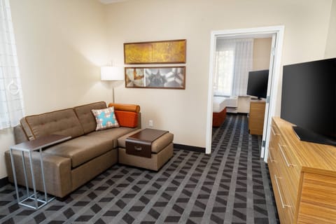 Suite, 1 Queen Bed, Corner | Desk, laptop workspace, iron/ironing board, free cribs/infant beds