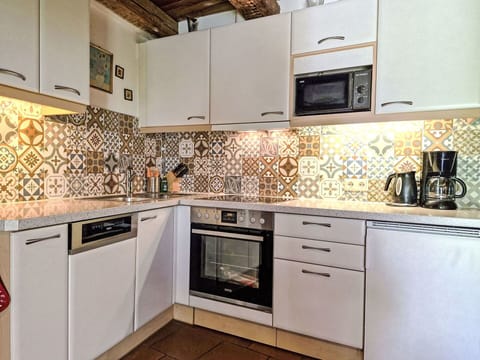 Flooring, Kitchen, Floor, Interior Design, Brown, Tile, Major Appliance, Mosaic, Room