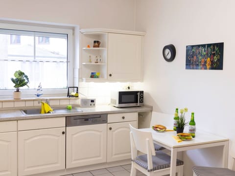 Furniture, Kitchen, Kitchen Appliance, Cabinetry, Interior Design, Countertop, Major Appliance, Flooring, Cupboard, Floor