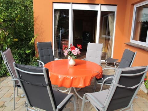 Plant, Furniture, Table, Property, Flower, Chair, Window, Flowerpot, Houseplant, Outdoor Table