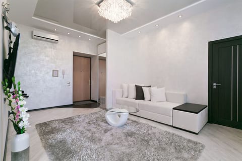 Deluxe Apartment (floor 5) | Living room | 43-inch flat-screen TV with cable channels, LED TV