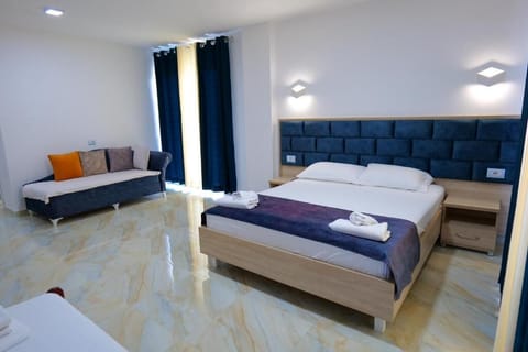 Deluxe Triple Room, Balcony, Sea View | Desk, free WiFi, bed sheets