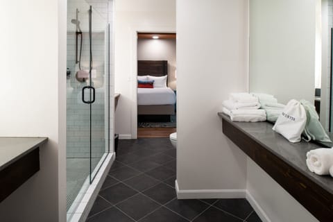 Shower, rainfall showerhead, designer toiletries, hair dryer