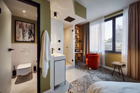 Deluxe Room, 1 King Bed | Bathroom | Shower, rainfall showerhead, designer toiletries, hair dryer