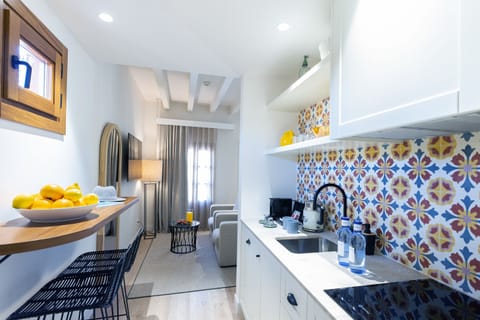 Luxury Studio Suite | Private kitchen | Full-size fridge, microwave, stovetop, coffee/tea maker