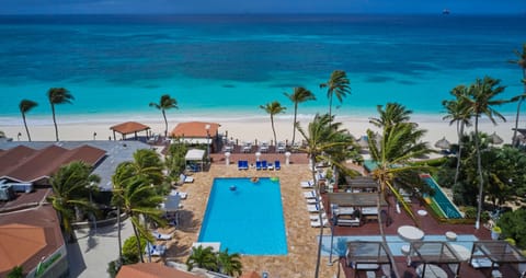 On the beach, white sand, sun loungers, beach towels