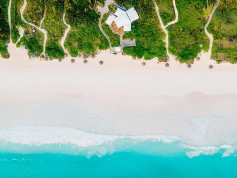 On the beach, white sand, free beach cabanas, sun loungers