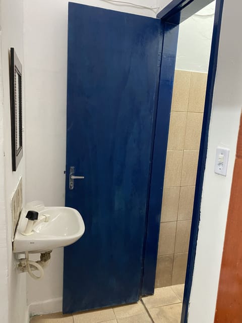 Basic Quadruple Room | Bathroom | Shower, towels, toilet paper