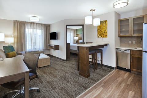 Suite, 1 Bedroom, Kitchen | In-room safe, desk, laptop workspace, iron/ironing board