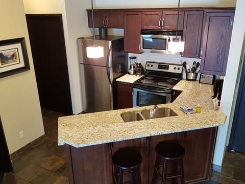 Luxury Condo, 1 Bedroom, Balcony, Mountain View | Private kitchen | Full-size fridge, microwave, oven, stovetop