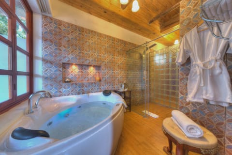 Presidential Suite, 1 King Bed with Sofa bed, Hot Tub | Bathroom | Shower, rainfall showerhead, free toiletries, hair dryer