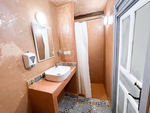 Standard Shared Dormitory, Mixed Dorm, Courtyard View, Courtyard Area | Bathroom | Shower, rainfall showerhead, towels, toilet paper