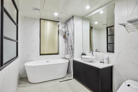 Combined shower/tub, designer toiletries, hair dryer, bathrobes