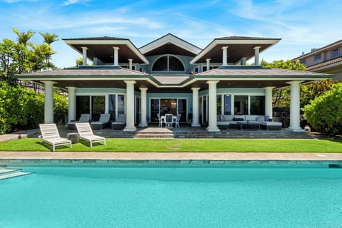 Kona Blue welcomes you to paradise with an oceanfront pool and swaying palms.