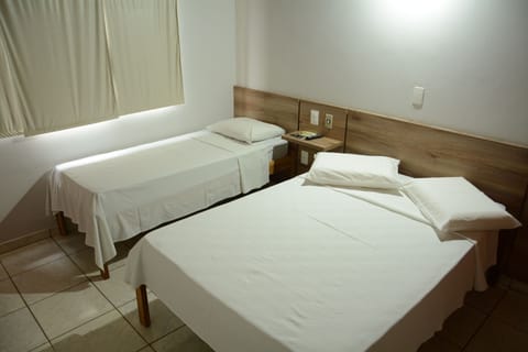 Standard Double Room | Minibar, blackout drapes, iron/ironing board, free WiFi