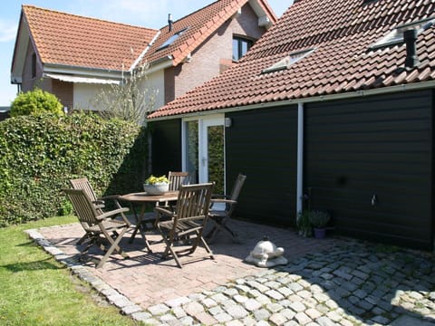 Building, Plant, Window, Chair, Sky, Road Surface, Architecture, Land Lot, Cottage, House