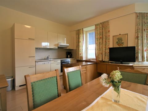 Furniture, Cabinetry, Countertop, Table, Building, Flower, Home Appliance, Wood, Interior Design, Kitchen Appliance