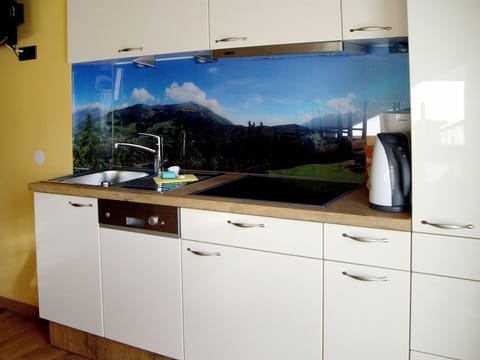 Cabinetry, Furniture, Countertop, Property, Drawer, Kitchen, Wood, Interior Design, Tap, Flooring