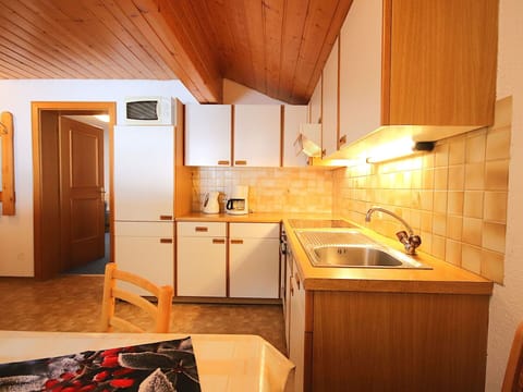 Wood, Interior Design, Ceiling, Countertop, Kitchen, Room, Wood Stain, Cabinetry, Hardwood, Sink