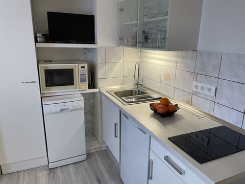 Cabinetry, Property, Countertop, Furniture, Kitchen Appliance, Kitchen Stove, Gas Stove, Cooktop, Kitchen Sink, Kitchen