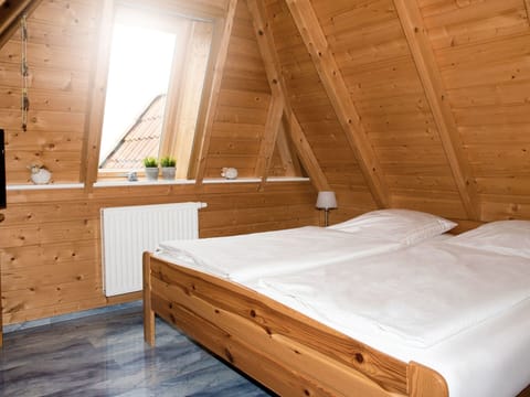 Bedroom, Room, Attic, Bed, Furniture, Bed Frame, Property, Wood, Wood Stain, Log Cabin