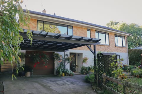 Driveway entrance showing upstairs part of the house
