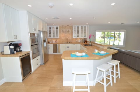 Spacious Open Kitchen (Fully Equipped) Features Counter Dining