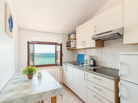 Countertop, Cabinetry, Building, Furniture, Property, Sink, Kitchen, Drawer, Chair, Table