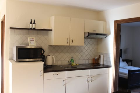 Standard Apartment, 2 Bedrooms, Patio | Private kitchen | Full-size fridge, microwave, stovetop, coffee/tea maker