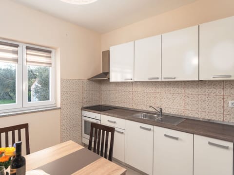 Kitchen, Countertop, Interior Design, Wood, Flooring, Kitchen Appliance, Cabinetry, Major Appliance, Sink, Floor