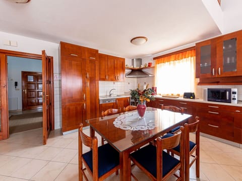 Table, Cabinetry, Furniture, Countertop, Wood, Door, Kitchen, Orange, Interior Design, Tableware