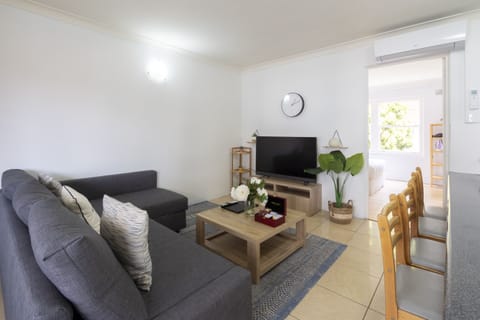 Deluxe Apartment, 1 Bedroom | Living area | 49-inch flat-screen TV with digital channels, Smart TV, Netflix
