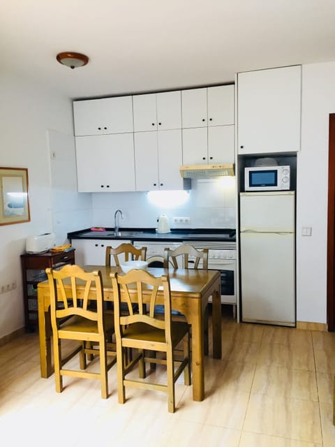 Apartment, 2 Bedrooms | Private kitchen | Fridge, microwave, stovetop, coffee/tea maker