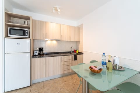 Apartment, 1 Bedroom | Private kitchen | Full-size fridge, microwave, stovetop, coffee/tea maker