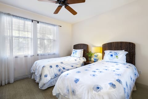 Bedroom 2 with Twin beds and nightstand.