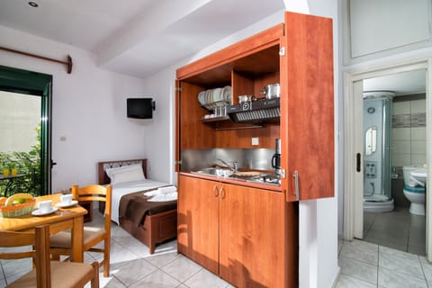 Apartment, 2 Bedrooms | Private kitchenette | Fridge, stovetop, coffee/tea maker, electric kettle