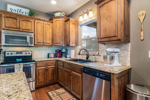 A regular coffee pot, Keurig, and Kitchen Aid mixer complete the kitchen!