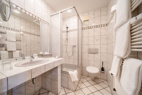 Shower, free toiletries, hair dryer, slippers