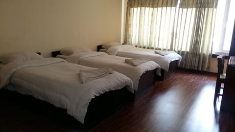 Standard Triple Room, 3 Twin Beds | Bathroom | Free toiletries, hair dryer, slippers, towels