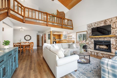 Living room with a view to the dining room and kitchen
