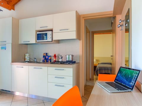 Room, Property, Orange, Furniture, Kitchen, Building, Yellow, Interior Design, Cabinetry, Turquoise