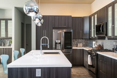 Walk into this clean open kitchen to prepare meals to share