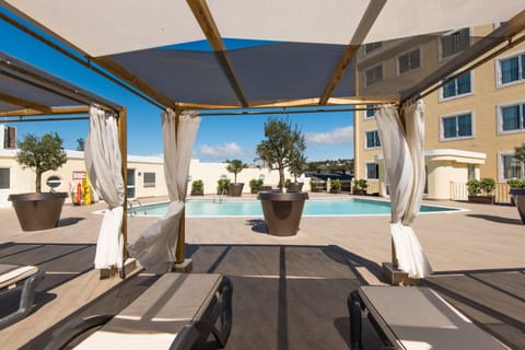 Outdoor pool, open 8:00 AM to 8:00 PM, pool umbrellas, sun loungers
