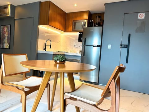 Deluxe Apartment | Private kitchen | Mini-fridge, highchair, cookware/dishes/utensils