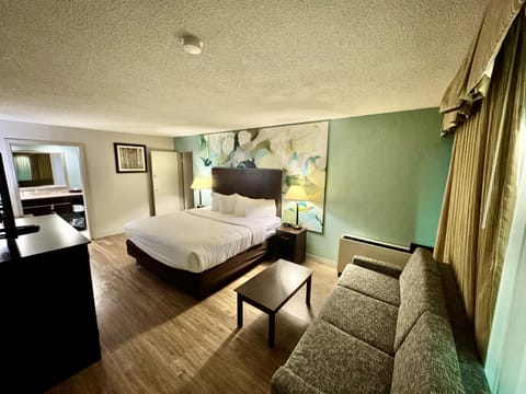 Suite, Non Smoking (1 King and 2 Double Beds) | Premium bedding, pillowtop beds, desk, blackout drapes