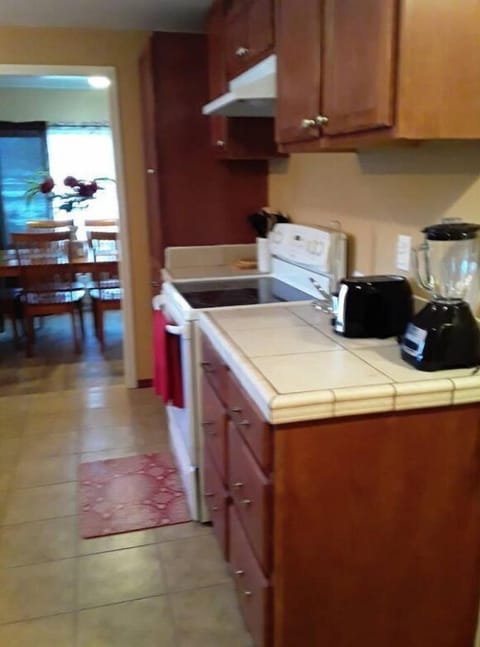 A full stocked kitchen with electric stove with oven, blender, toaster,etc. 