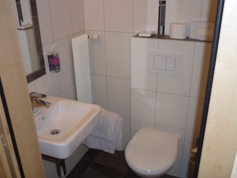 Economy Single Room, Shared Bathroom | Bathroom | Shower, hair dryer, towels