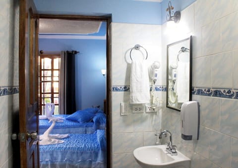 Deluxe Triple Room | Bathroom | Shower, towels, soap, toilet paper