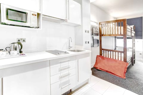 Family Suite, 1 King Bed, Bunk Beds, Kitchenette | Pillowtop beds, in-room safe, desk, blackout drapes